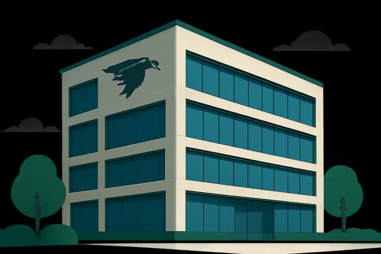 Prédio comercial moderno com o logo da Águia Consultoria Imobiliária